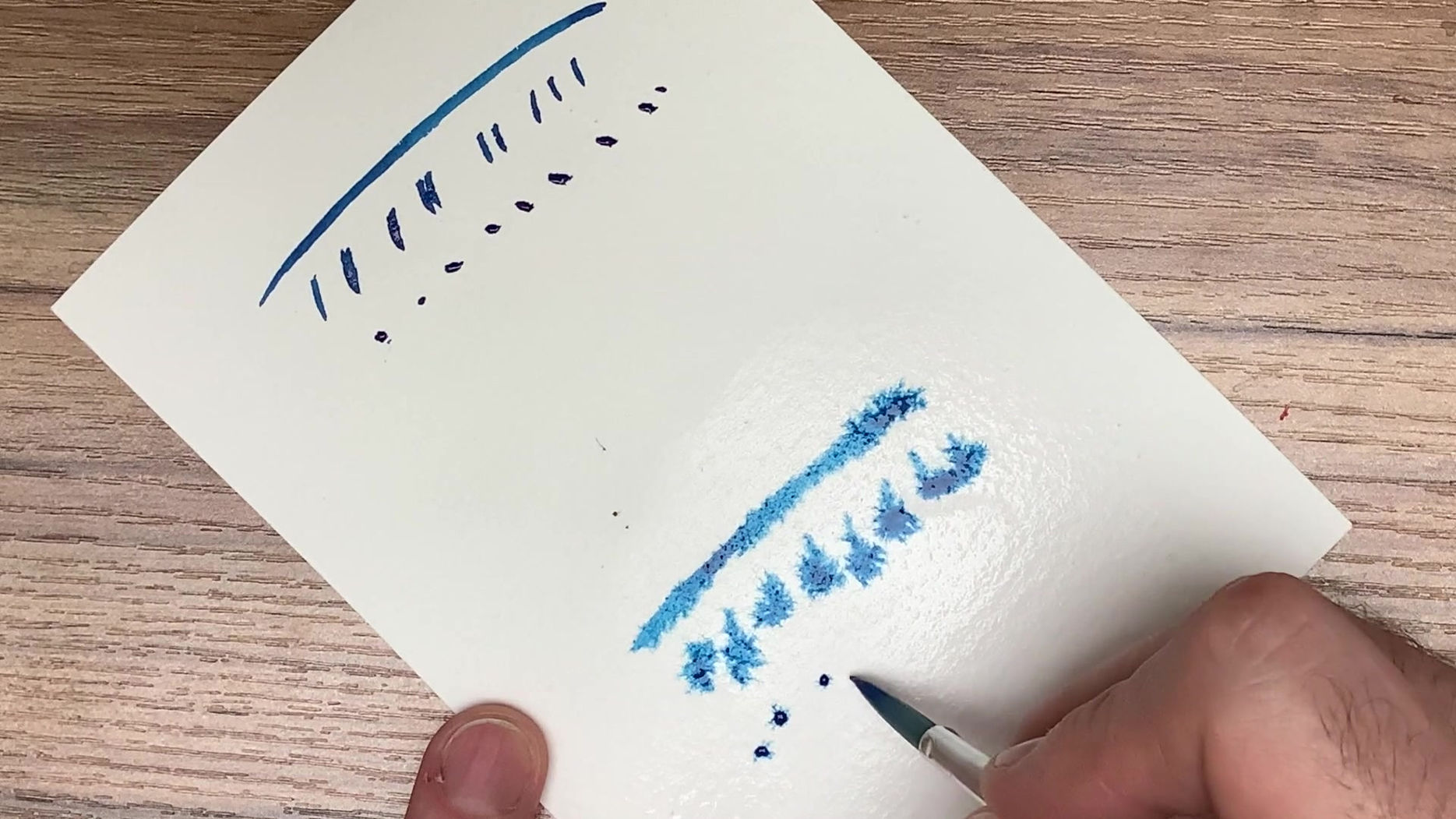 putting paint onto paper